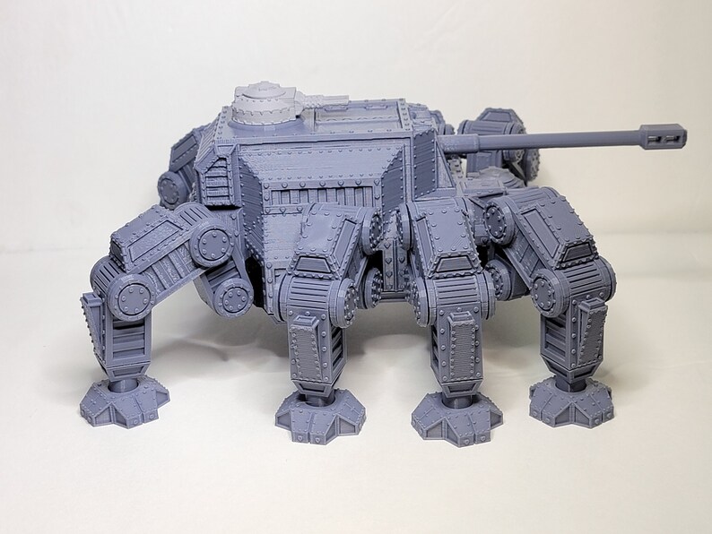May include: A gray, 3D printed, six-legged, tank-like model with a turret and a long cannon.