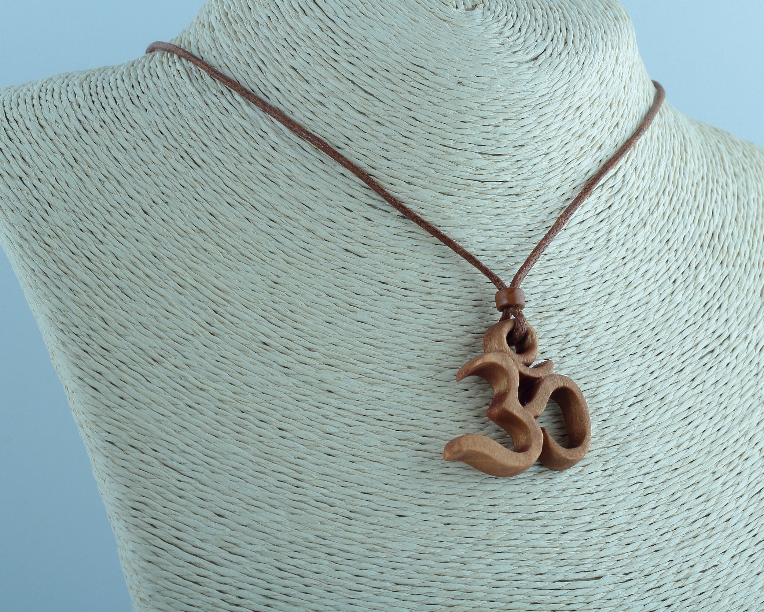Wooden om pendant sale