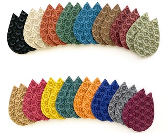 May include: Assortment of 20 leather teardrop shaped earrings in various colors, including red, orange, yellow, green, blue, and brown. Each earring features a honeycomb pattern.