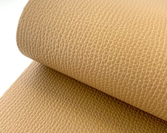 May include: Close-up of a light brown faux leather fabric with a textured surface.