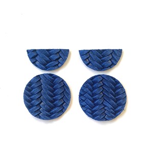 May include: Four blue leather earrings with a woven pattern. Two are round and two are half-circles.