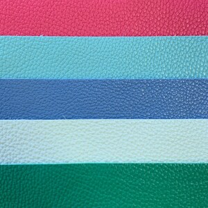 May include: Five horizontal stripes of fabric in different colors. The top stripe is red, the second is light blue, the third is dark blue, the fourth is white, and the bottom stripe is green.