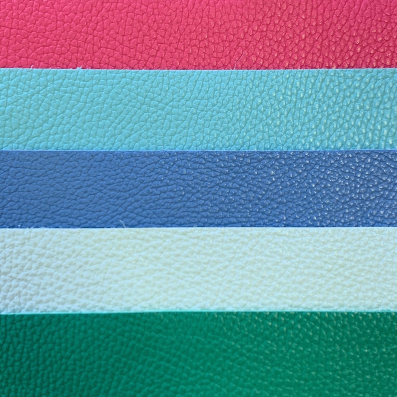 May include: Five horizontal stripes of fabric in different colors. The top stripe is red, the second is light blue, the third is dark blue, the fourth is white, and the bottom stripe is green.