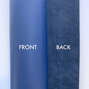 May include: Close-up of a blue leather material with a textured surface on the front and a smooth, dark blue suede surface on the back. The words "FRONT" and "BACK" are printed in white on the material.
