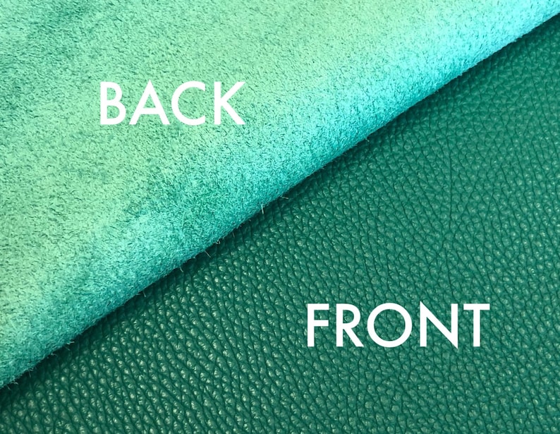 May include: Close-up of a piece of teal leather with a smooth, suede-like texture on the back and a textured, pebbled surface on the front. The words "BACK" and "FRONT" are printed on the leather.