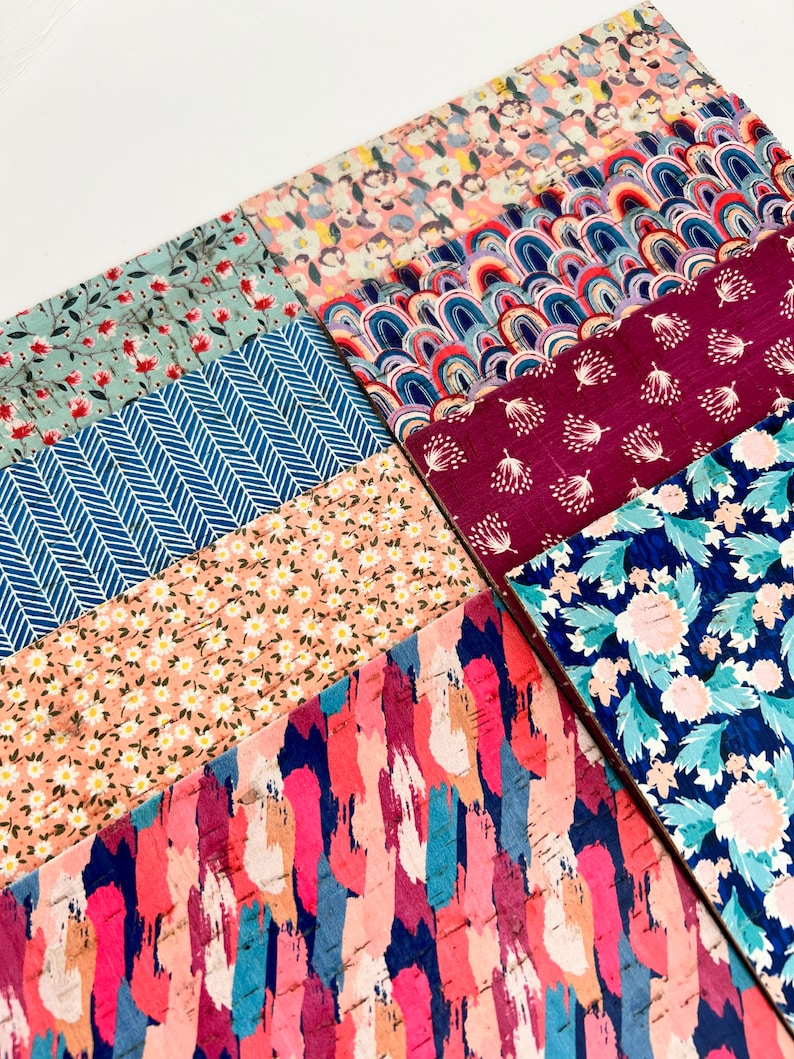 May include: A collection of patterned fabric squares in various colors and designs, including floral, geometric, and abstract patterns. The fabrics are arranged in a grid pattern, with each square showcasing a different design.