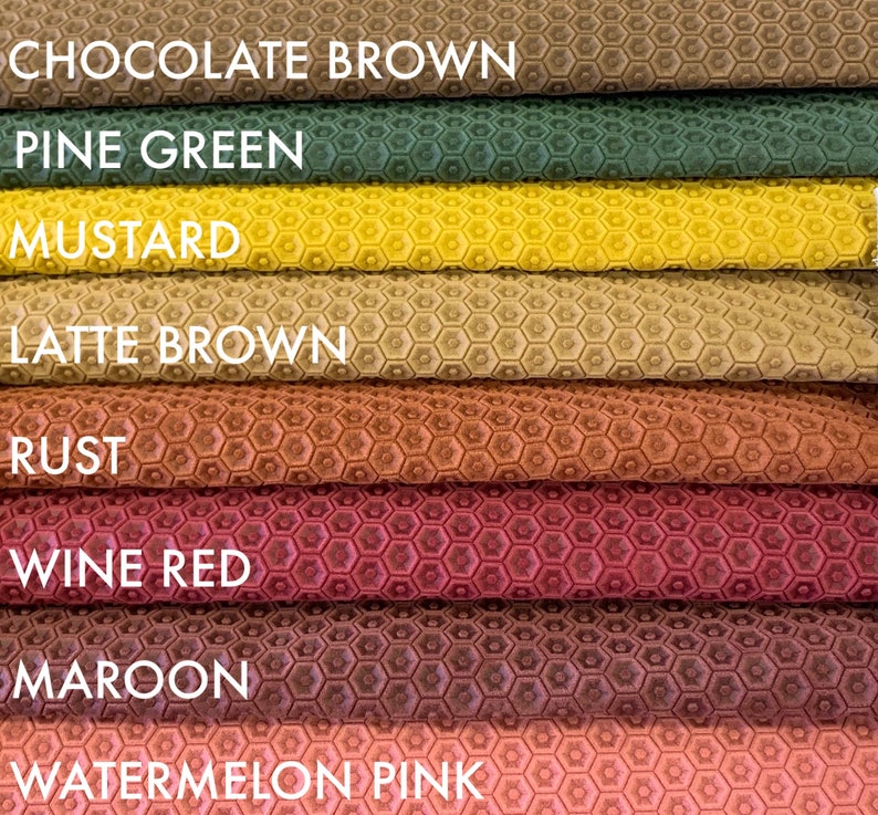 May include: Close-up of eight fabric swatches with a honeycomb pattern. The swatches are arranged in a stack from top to bottom: Chocolate Brown, Pine Green, Mustard, Latte Brown, Rust, Wine Red, Maroon, and Watermelon Pink.