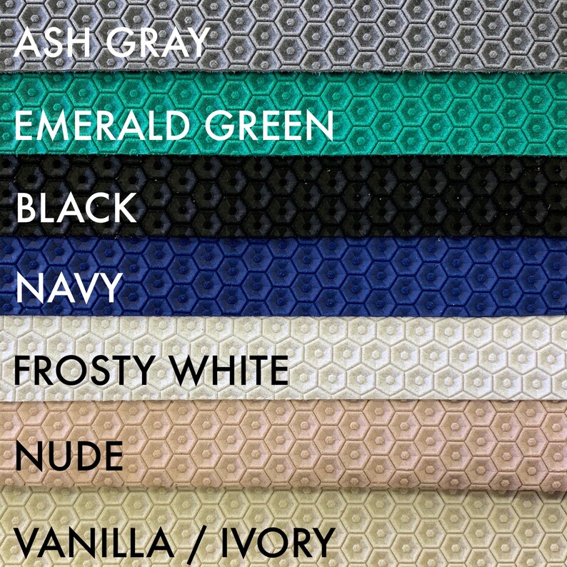 May include: A close-up of seven fabric swatches with a honeycomb pattern. The swatches are in the following colors: ash gray, emerald green, black, navy, frosty white, nude, and vanilla/ivory.