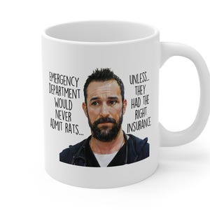 May include: White ceramic mug with a portrait of a man with a beard. The mug has text that reads, "Emergency Department Would Never Admit Rats... Unless They Had The Right Insurance."