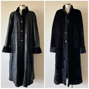 May include: A reversible long coat featuring a smooth black leather side with textured black fur trim on the collar, cuffs, and front placket, and a solid black fur side with a matching fur-trimmed collar, cuffs, and front button closure.