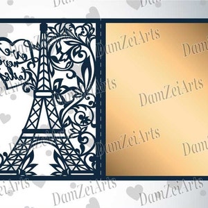 May include: A navy blue laser-cut card featuring the Eiffel Tower and floral designs. A heart with the words "Forever Salia" is above the tower. The card opens to reveal a gold-colored interior. The card is a romantic theme.