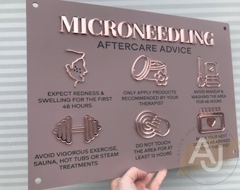 May include: A pink sign with the text "MICRONEEDLING AFTERCARE ADVICE" in rose gold lettering. The sign has six rose gold icons with instructions for aftercare, including avoiding makeup and washing the area for 48 hours, avoiding vigorous exercise, sauna, hot tubs or steam treatments, and only applying products recommended by your therapist.