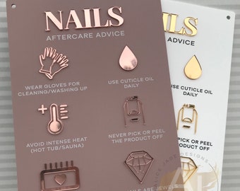 May include: Two rectangular signs with nail care advice. One is dusky pink with rose gold mirror accents, the other is white with gold mirror accents. Text includes "NAILS", "AFTERCARE ADVICE", and care tips with icons.