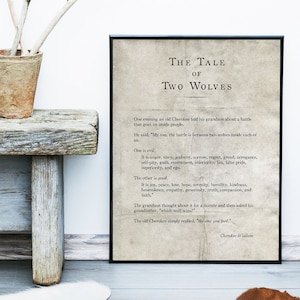 May include: A black and white print of a quote about the battle between two wolves, one representing good and the other evil. The quote is attributed to Cherokee Wisdom. The print is framed in a black frame.