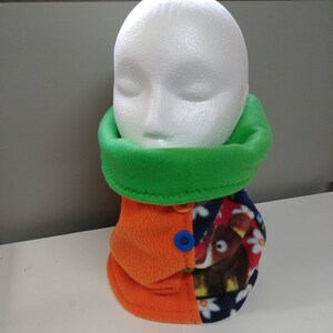 Reversible neck warmer. Orange neck warmer. Green neck warmer. Orange adult snood. Adult snood. Polar neck warmer. Women's neck warmer. Women's snood