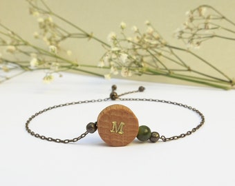 Dainty wooden charm bracelet with green herbal print on a fine chain customizable with an initial. Personalized unique gift for her
