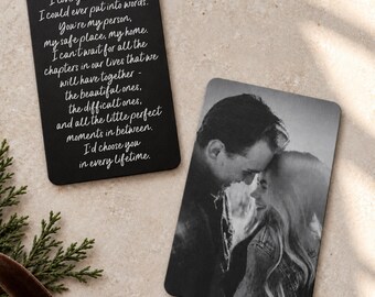 May include: Two rectangular metal wallet cards with rounded corners. One card features white cursive text on a black background reading I love you more than I could ever put into words. The second card displays a black and white photograph of a couple.