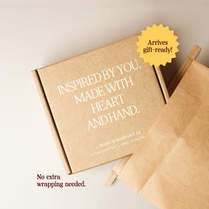May include: A square brown cardboard shipping box with white text that reads INSPIRED BY YOU. MADE WITH HEART AND HAND. HEART & HAND GIFT CO ARTISAN CRAFTED | MADE IN CALIFO. A yellow starburst graphic says Arrives gift-ready! and text reads No extra wrapping needed.