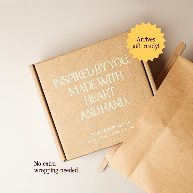 May include: A square brown cardboard shipping box with white text that reads INSPIRED BY YOU. MADE WITH HEART AND HAND. HEART & HAND GIFT CO ARTISAN CRAFTED | MADE IN CALIFO. A yellow starburst graphic says Arrives gift-ready! and text reads No extra wrapping needed.