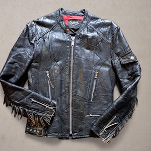 Veste droite en cuir pour femme avec franges sur les bras taille M