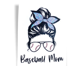 May include: A white print featuring a black and white illustration of a woman's hair in a bun with a sparkly blue bow. The woman is wearing sunglasses with baseball stitching. The words "Baseball Mom" are written in black script below.