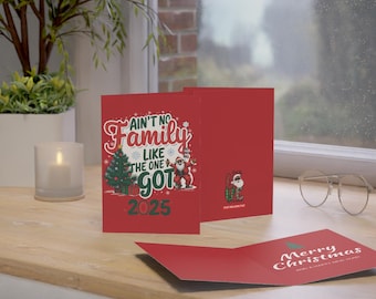 May include: Red Christmas card with a cartoon Santa Claus and the text "Ain't no family like the one I got 2025". The inside of the card has a Christmas tree and the text "Merry Christmas".
