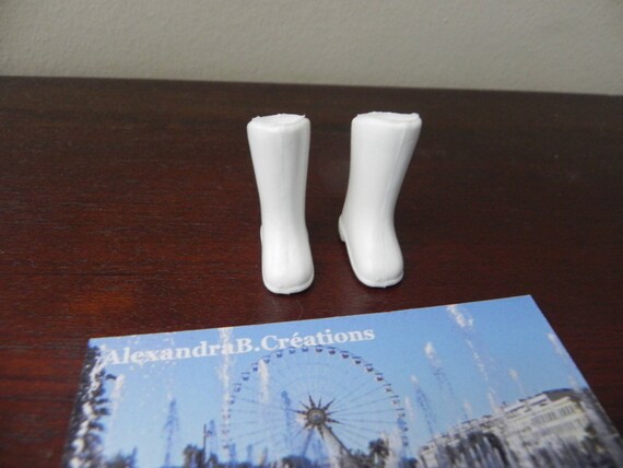 white plastic boots