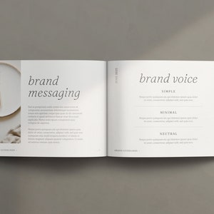 May include: Open book with a white background. The left page has a photo of a whisk and a white plate. The right page has the text "brand voice" with the words "simple", "minimal", and "neutral" listed below. The text on both pages is in a simple, minimalist font.