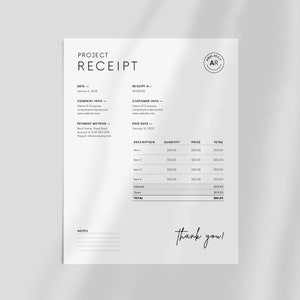 May include: A black and white project receipt with the words "Project Receipt" at the top. The receipt includes a date, company information, customer information, payment method, paid date, description, quantity, price, and total. The total amount is $500.00. The receipt also includes a note section and the words "thank you!" at the bottom.