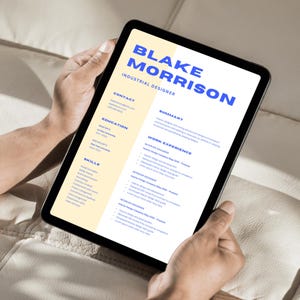 May include: A digital tablet displaying a CV for Blake Morrison, an Industrial Designer. The CV includes sections for contact information, education, work experience, skills, and a summary.