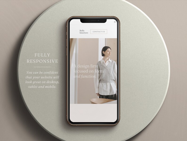 May include: A smartphone with a gold frame displays a website mockup for "Belle Interiors." The website features a woman in a neutral-toned outfit. Text on the phone reads "A design firm focused on form and function." The background includes the text "FULLY RESPONSIVE."