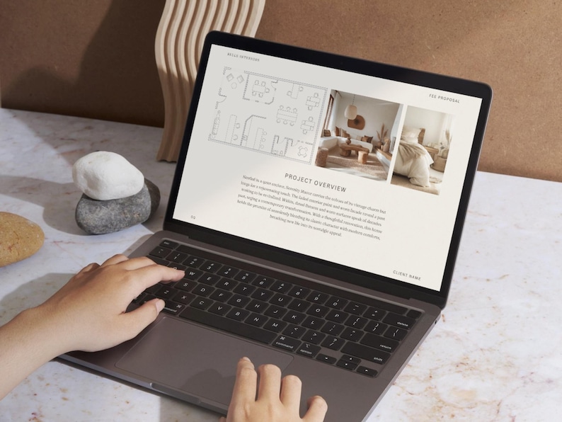 May include: A laptop computer displaying a presentation with a floor plan, a living room interior design, and a bedroom interior design. The presentation includes the text "Project Overview" and "Client Name".