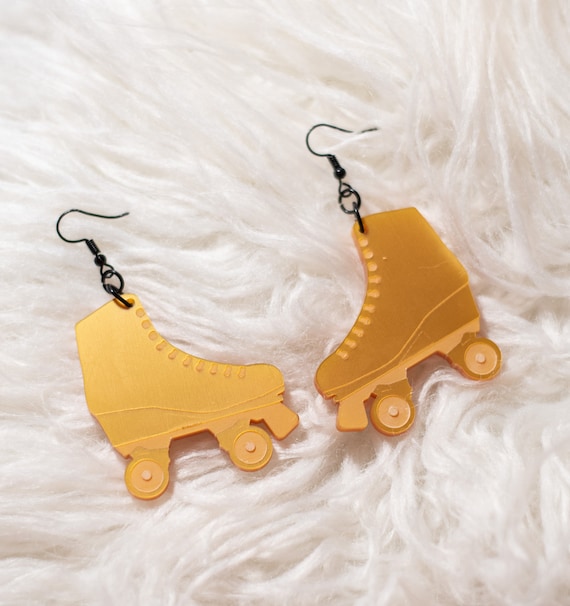 Skate gold statement earrings