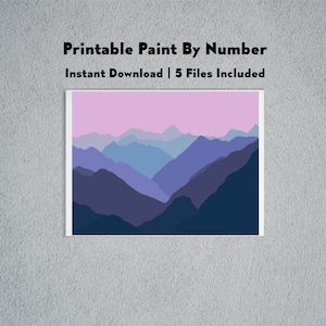May include: Printable paint by number image of a mountain range with a pink sky. The image is made up of multiple layers of blue and purple mountains.