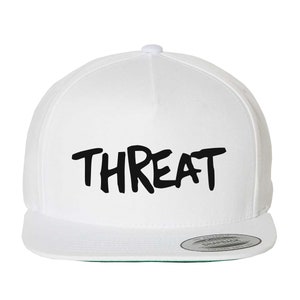 May include: White baseball cap with a black "THREAT" logo in a graffiti style font.