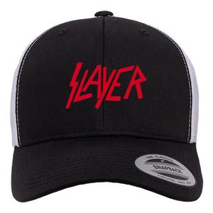 May include: Black and white trucker hat with a red "Slayer" logo on the front. The hat has a mesh back and a black adjustable strap.