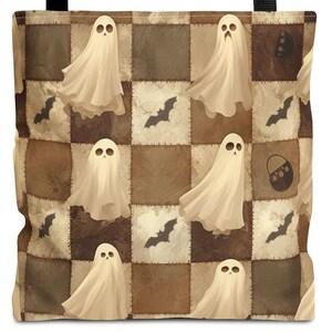 May include: A brown and tan checkered tote bag with a black handle. The bag features a repeating pattern of white ghosts and bats.