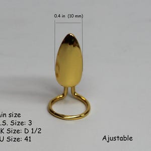 May include: Gold-tone adjustable ring sizer with a teardrop-shaped top. The ring sizer measures 0.4 inches (10 mm) in height. The text "Ajustable" is printed below the ring sizer.  Min size: U.S. Size: 3, UK Size: D 1/2, EU Size: 41.