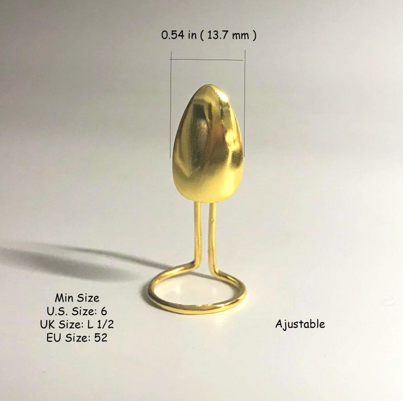May include: Gold ring with a teardrop-shaped setting. The ring is adjustable and has a minimum size of 6 (US), L 1/2 (UK), or 52 (EU). The ring is 0.54 inches (13.7 mm) tall.