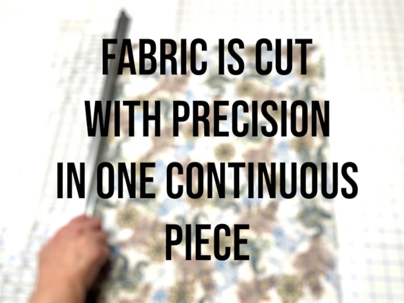 May include: Image shows fabric being cut with precision. The fabric has a floral pattern in shades of brown, blue, and white. The text on the image reads: "FABRIC IS CUT WITH PRECISION IN ONE CONTINUOUS PIECE."