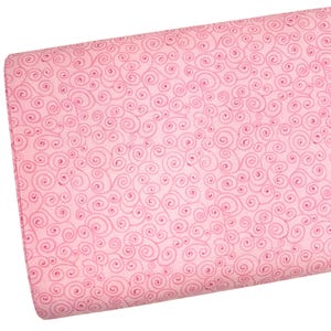 May include: A roll of pink fabric with a repeating pattern of swirling, scroll-like designs in a slightly darker shade of pink. The fabric appears to be cotton or a similar material, suitable for quilting or crafting projects.