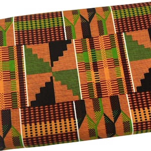 May include: Folded fabric with a vibrant geometric pattern. The design features a mix of orange, green, black, and white rectangular shapes and lines. The fabric appears to be tightly woven, suggesting a durable material suitable for various crafting projects.