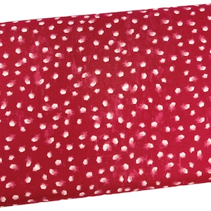 May include: Red fabric with a white polka dot pattern. The dots are slightly irregular in shape and size.