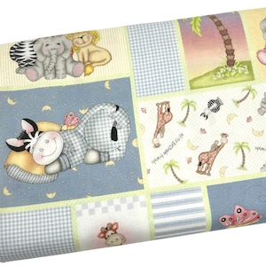 May include: A rolled-up fabric featuring a patchwork design with cartoon animals. The fabric includes images of a zebra, elephant, lion, giraffe, and butterfly. The color palette includes blue, yellow, and green, with the text "All My Zazople Friends" and "Sweet Dream".
