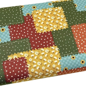 May include: A patchwork fabric with a variety of colors and patterns, including green, red, yellow, and blue. The fabric features a quilt-like design with squares and rectangles.