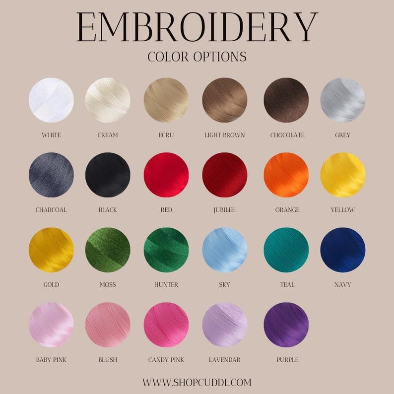 May include: A color chart for embroidery thread, featuring a variety of colors. The chart includes shades like white, cream, black, red, orange, yellow, green, blue, pink, and purple. The text "EMBROIDERY COLOR OPTIONS" is at the top, with the website address www.shopcuddl.com at the bottom.
