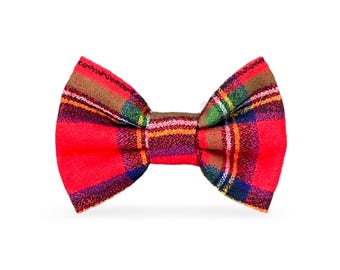 May include: Red plaid bow tie with a green, yellow, and blue plaid pattern.