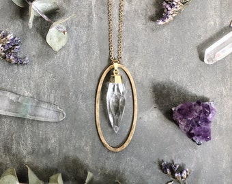 Otisco Necklace ~ Quartz Spike ~ Gold plated Clear Teardrop Bullet Gemstone Crystal &  hammered brass oval Pendant Long Chain EJ1