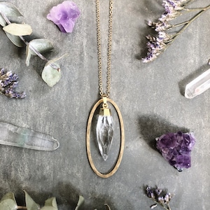 Otisco Necklace ~ Quartz Spike ~ Gold plated Clear Teardrop Bullet Gemstone Crystal &  hammered brass oval Pendant Long Chain EJ1