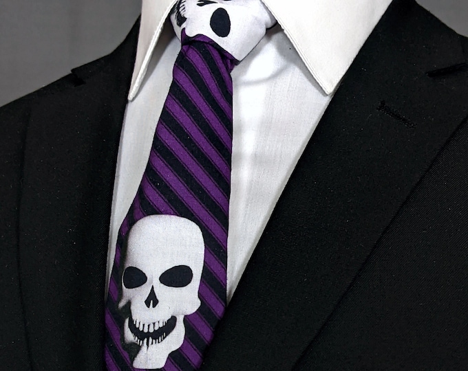 This Item is Clearance because of flaw in the fabric**** Please item description for details. Purple Stripe Skull Tie –